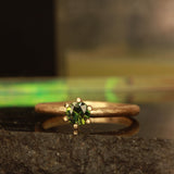 green solitare ring