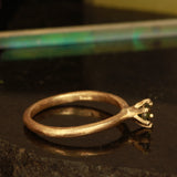 green solitare ring