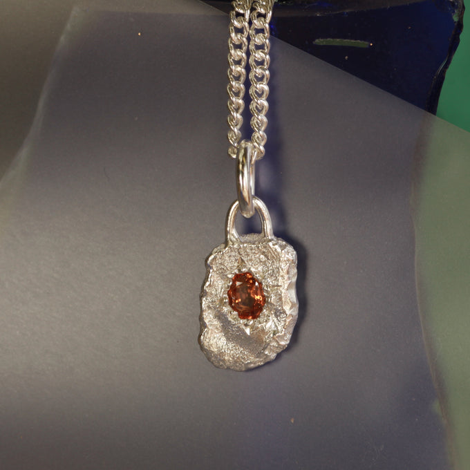 Orange sapphire pendant