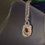Orange sapphire pendant