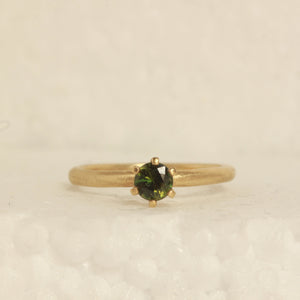 green solitare ring