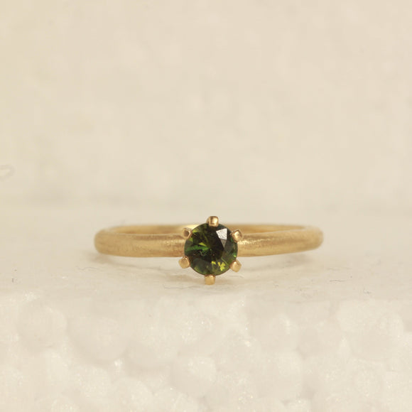 green solitare ring