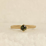 green solitare ring