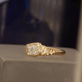Radiant cut ring pear side stones