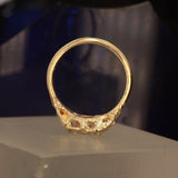 Radiant cut ring pear side stones